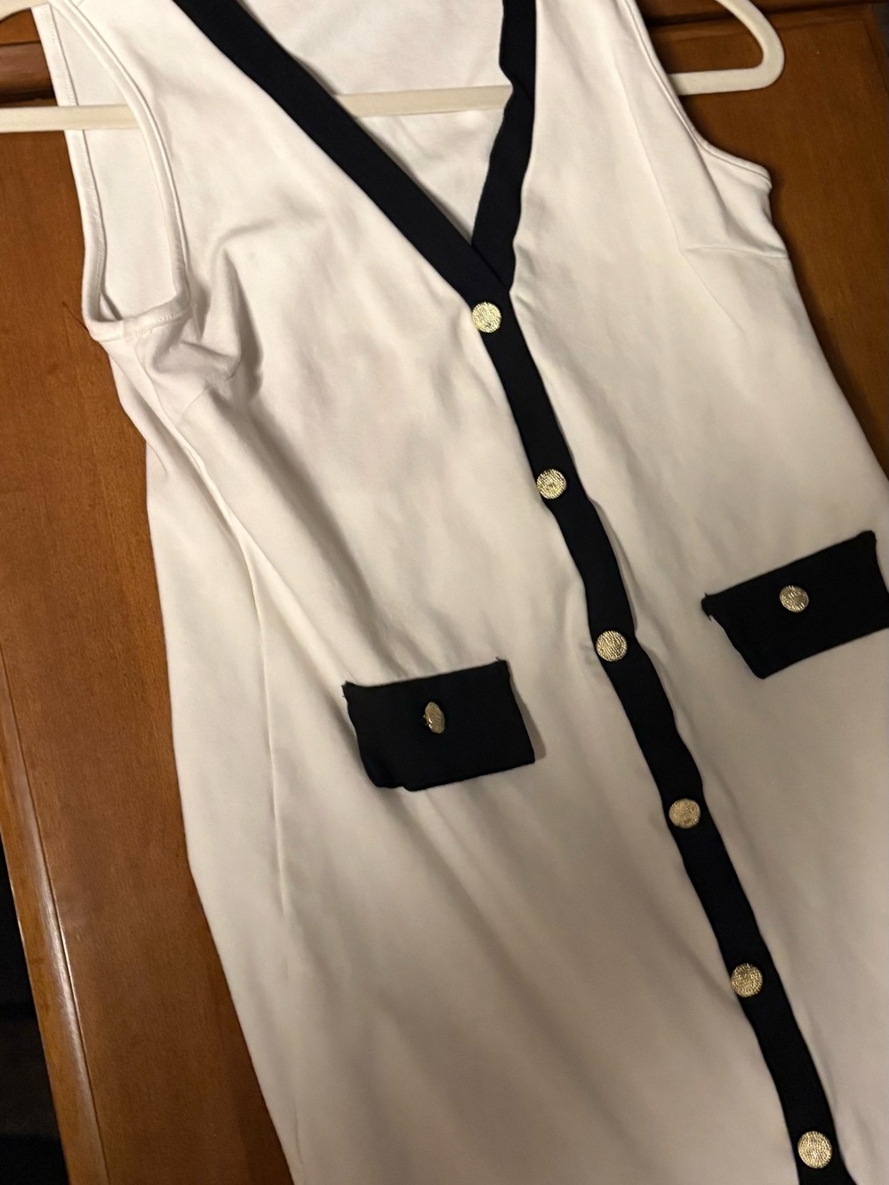 Sleeveless White Midi Dress with Black Trim and Gold Buttons